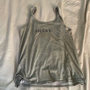 The brand is Danskin, size M, color is a pastel light green